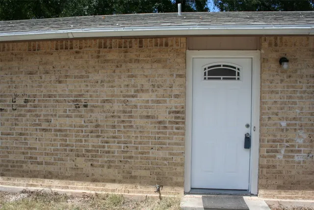 a room with a refrigerator and washer