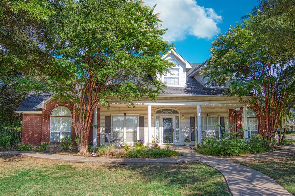 1650 North St Charles Street Pilot Point, TX 76258 - Photo 1 of 1 a front view of a house with a yard
