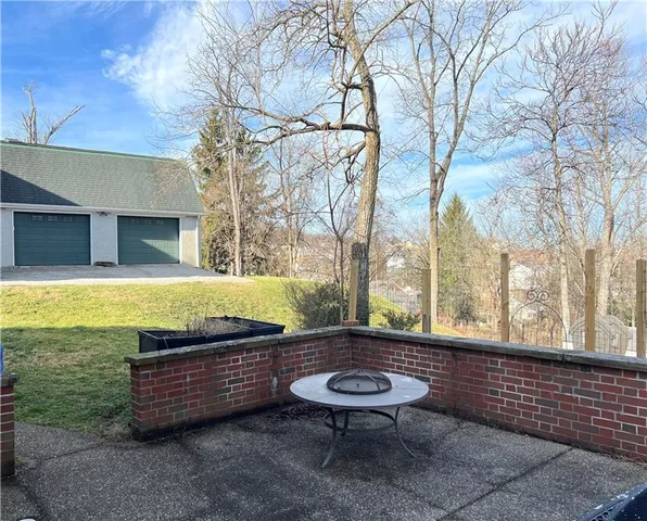 a blue bench sitting in front of a building