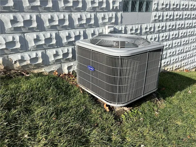 a view of a chair and table in the backyard