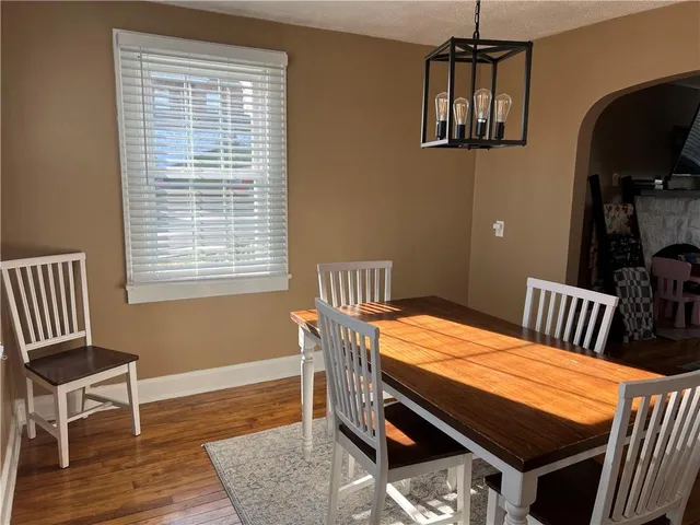 a bedroom with furniture and wooden floor