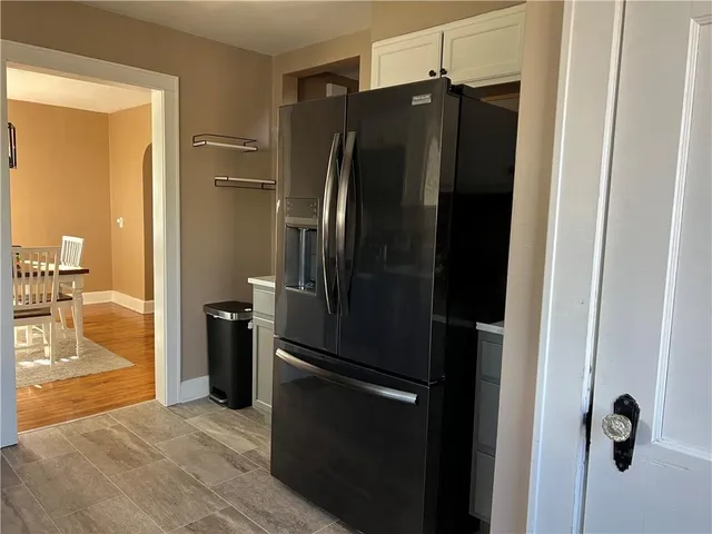 a bathroom with a shower and a mirror