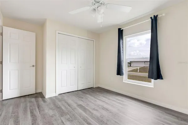 a view of an empty room with a window