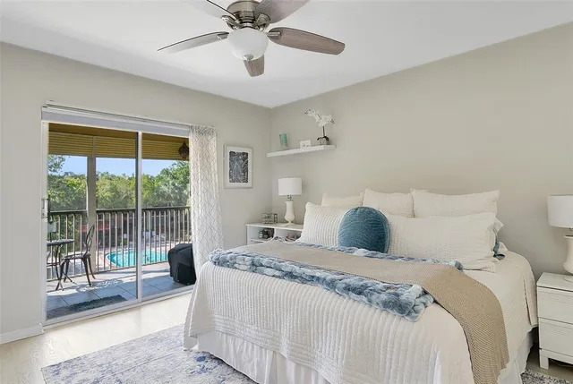 a bedroom with a large bed and a large window