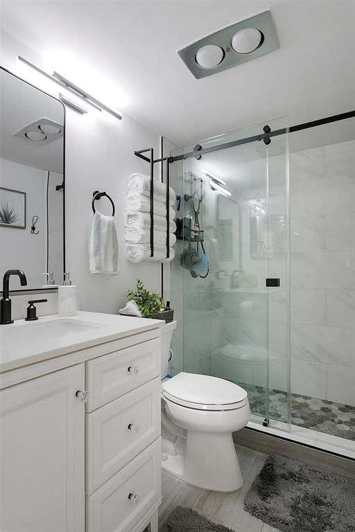 259 South Cypress Road, Unit 546 Pompano Beach, FL 33060 - Photo 16 of 23 a bathroom with a sink a toilet and shower