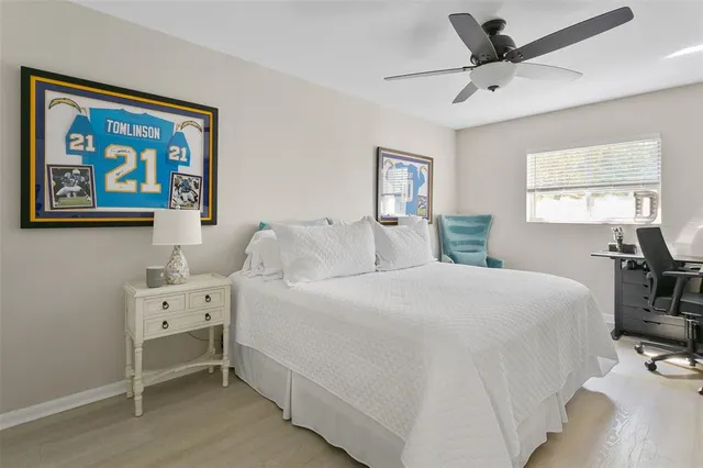 a bedroom with a bed and a desk