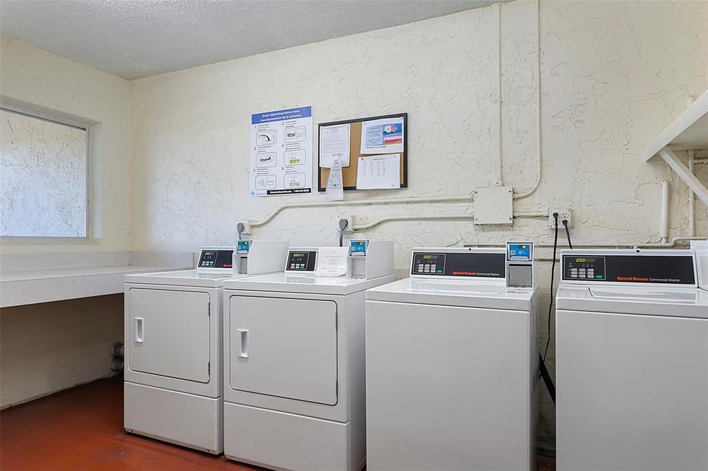 259 South Cypress Road, Unit 546 Pompano Beach, FL 33060 - Photo 21 of 23 a utility room with dryer and washer