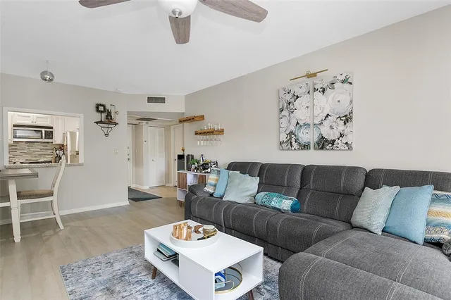 a living room with furniture and a table