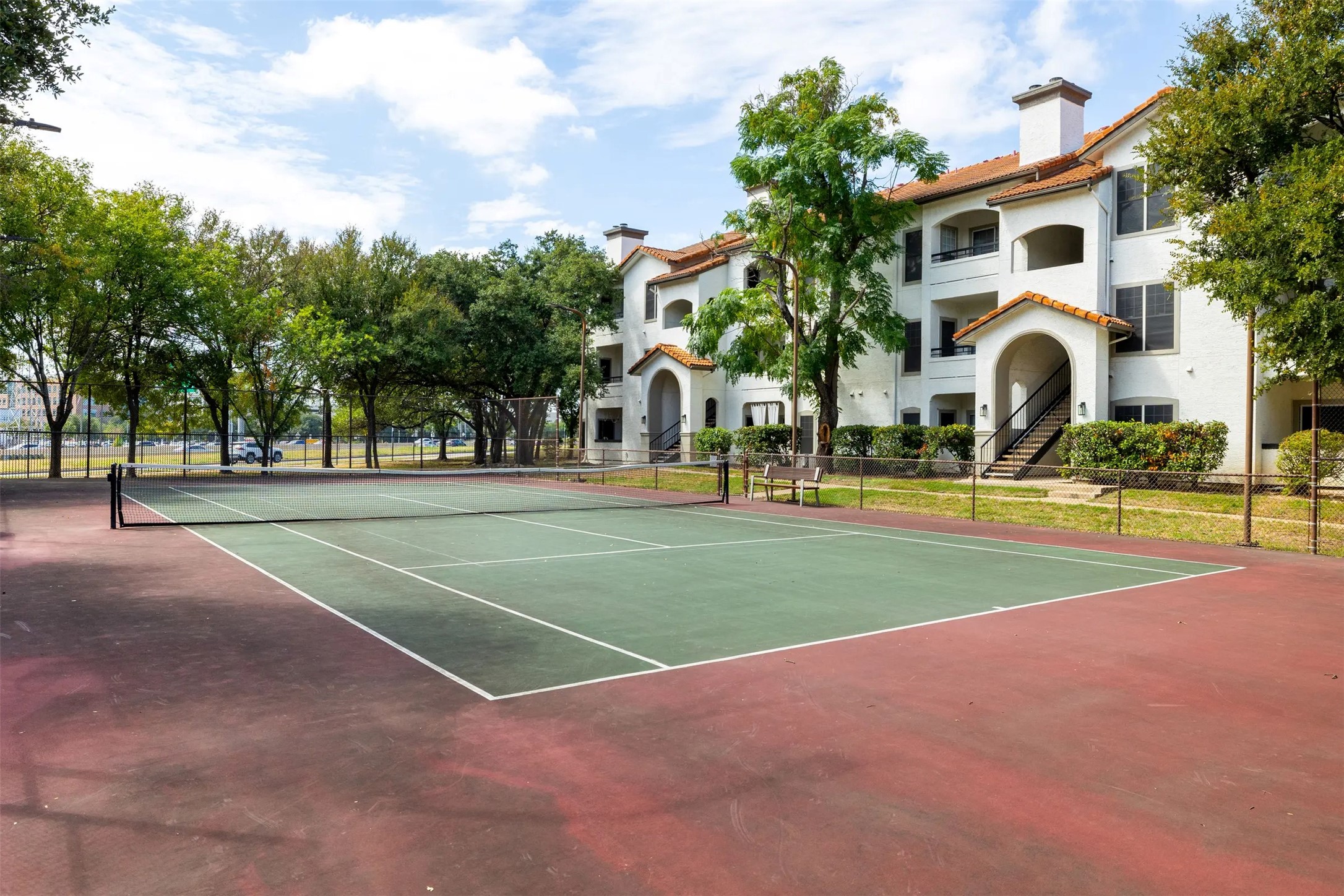3201 Duval Road, Unit 131331 Austin, TX 78759 - Photo 20 of 22 a view of a white house with a big yard and palm trees