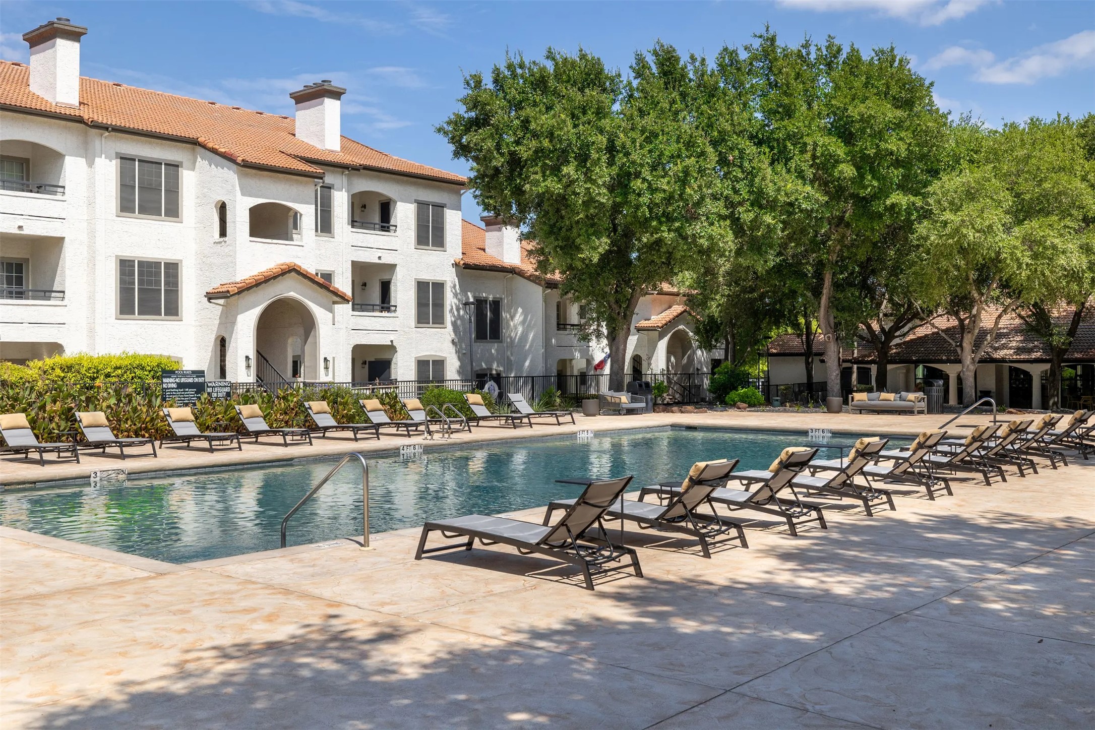 3201 Duval Road, Unit 131331 Austin, TX 78759 - Photo 22 of 22 a front view of a house with swimming pool and sitting area