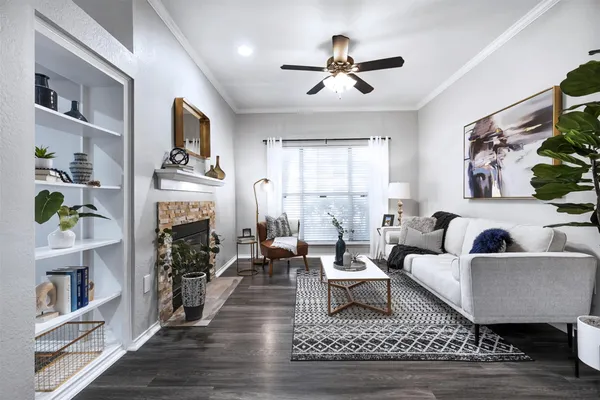 a living room with furniture and a fireplace