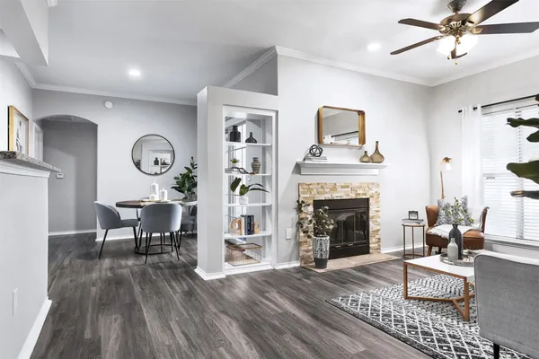 a living room with furniture and a fireplace