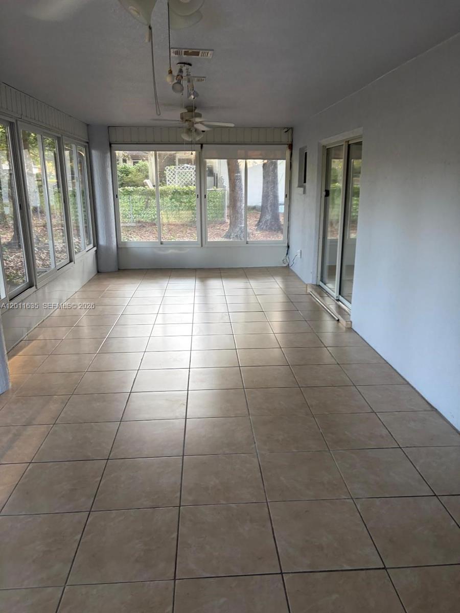 6064 Southwest 103rd Loop Ocala, FL 34476 - Photo 3 of 9 a view of an empty room with a window