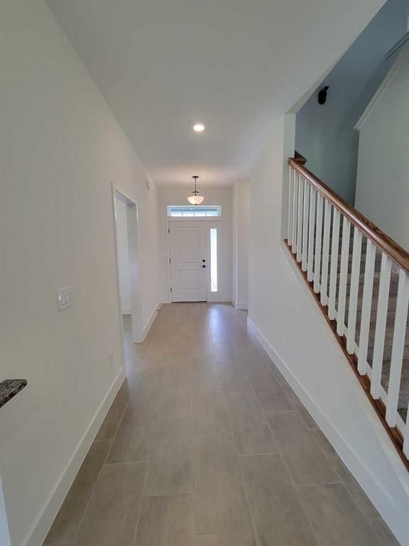 4380 Southwest 92nd Pl Road Ocala, FL 34476 - Photo 25 of 57 a view of a hallway with wooden floor