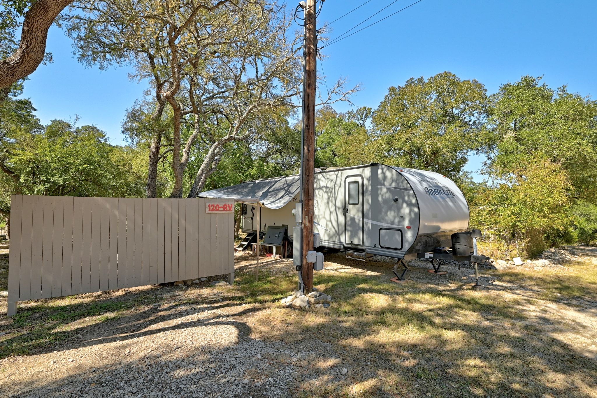 120 Cedar Bend Road Wimberley, TX 78676 - Photo 36 of 40 a view of a barn in the middle of a yard