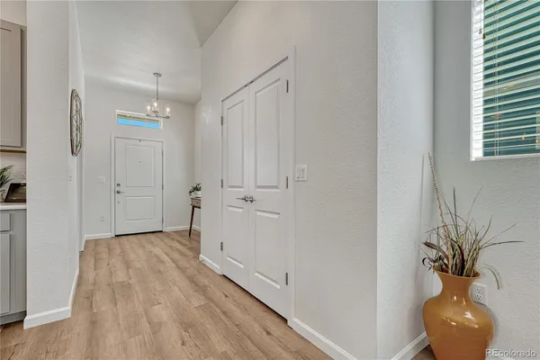 a view of empty room with wooden floor and cabinet