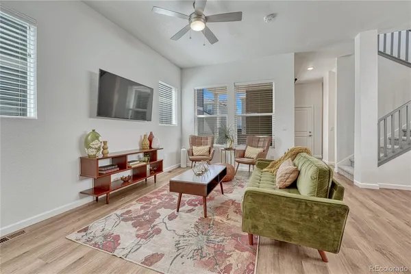 a living room with furniture and a window