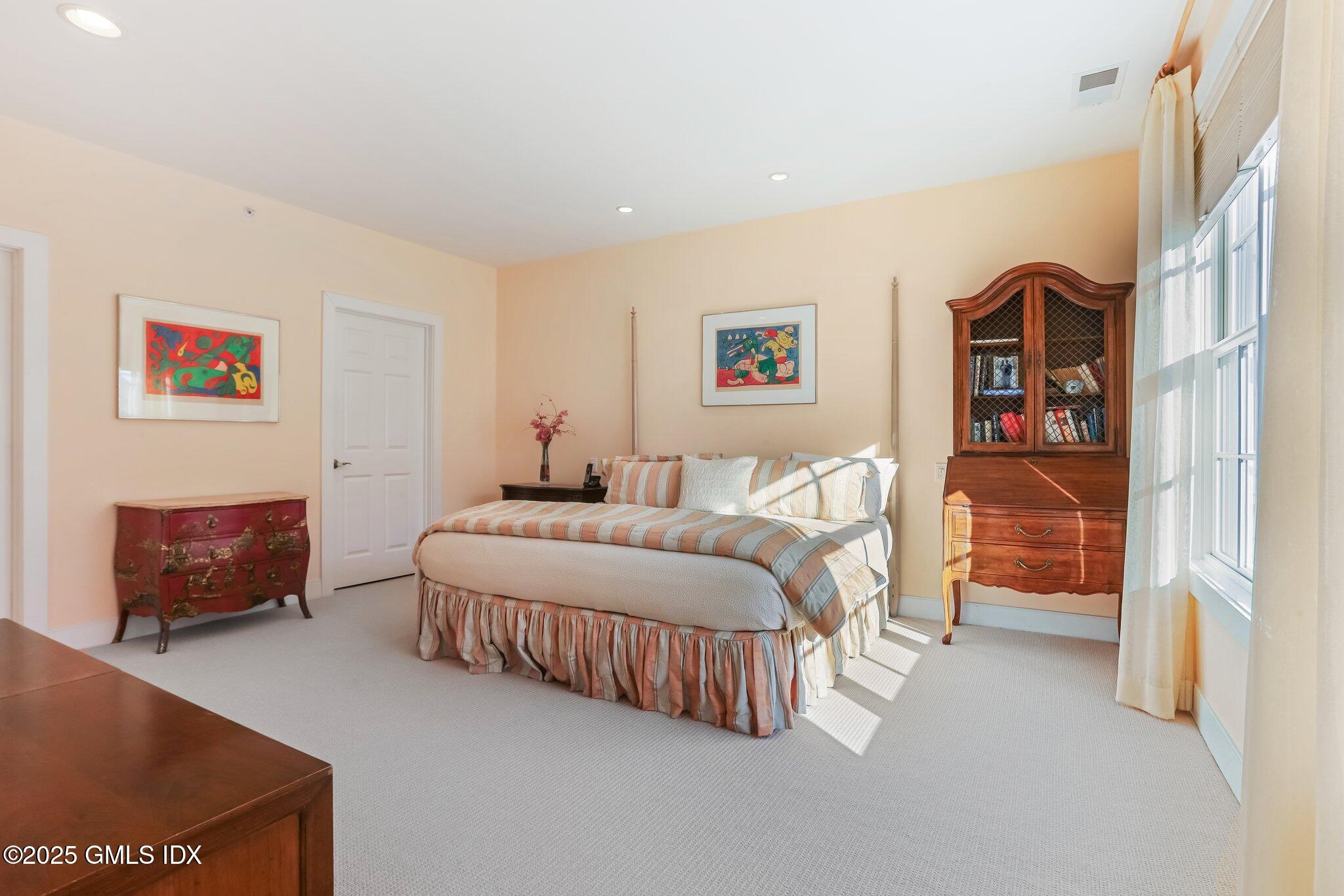 77 Havemeyer Lane, Unit 426 Stamford, CT 06902 - Photo 11 of 23 a bedroom with a bed and a couch