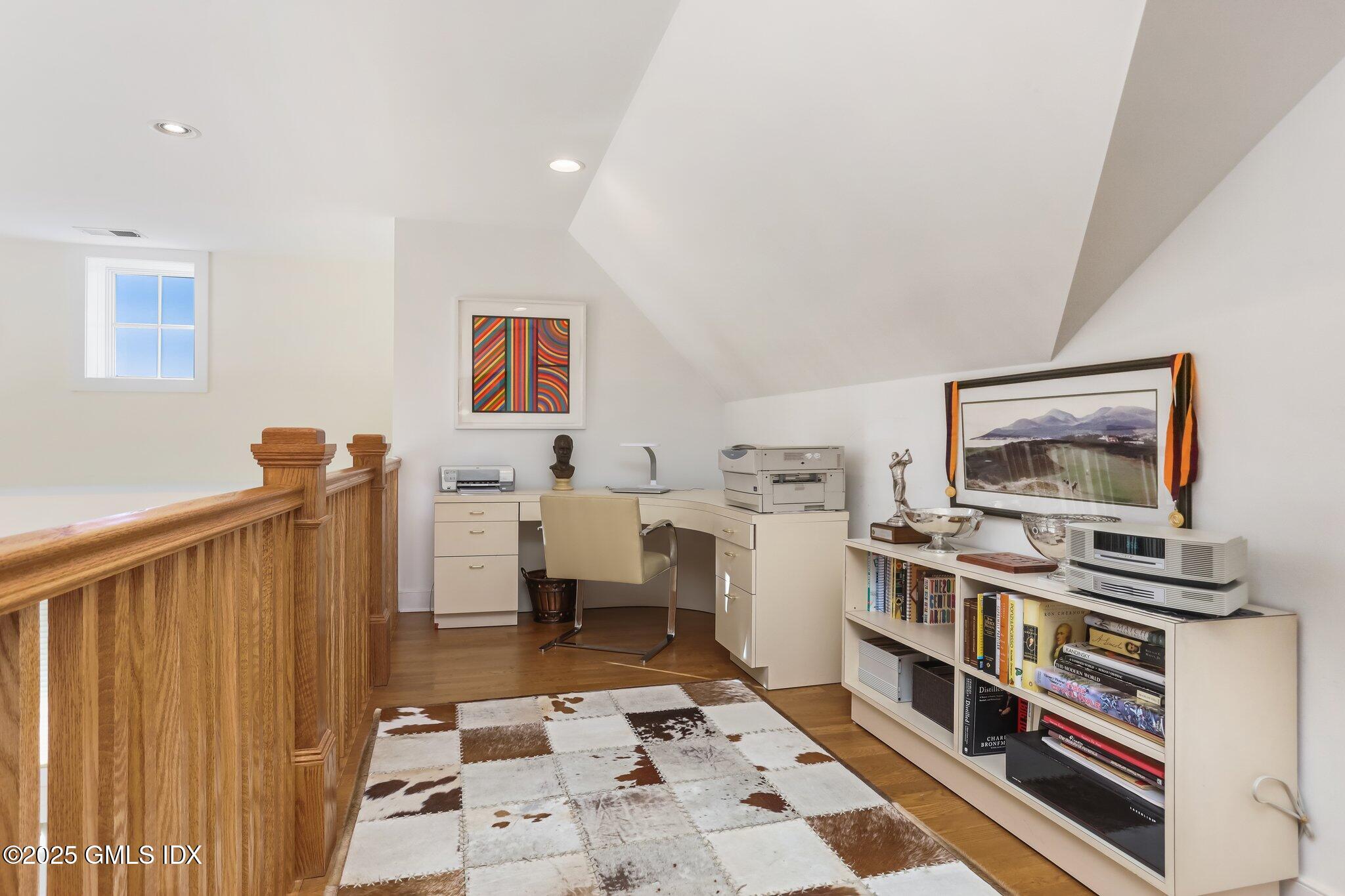 77 Havemeyer Lane, Unit 426 Stamford, CT 06902 - Photo 15 of 23 a room with furniture and a book shelf