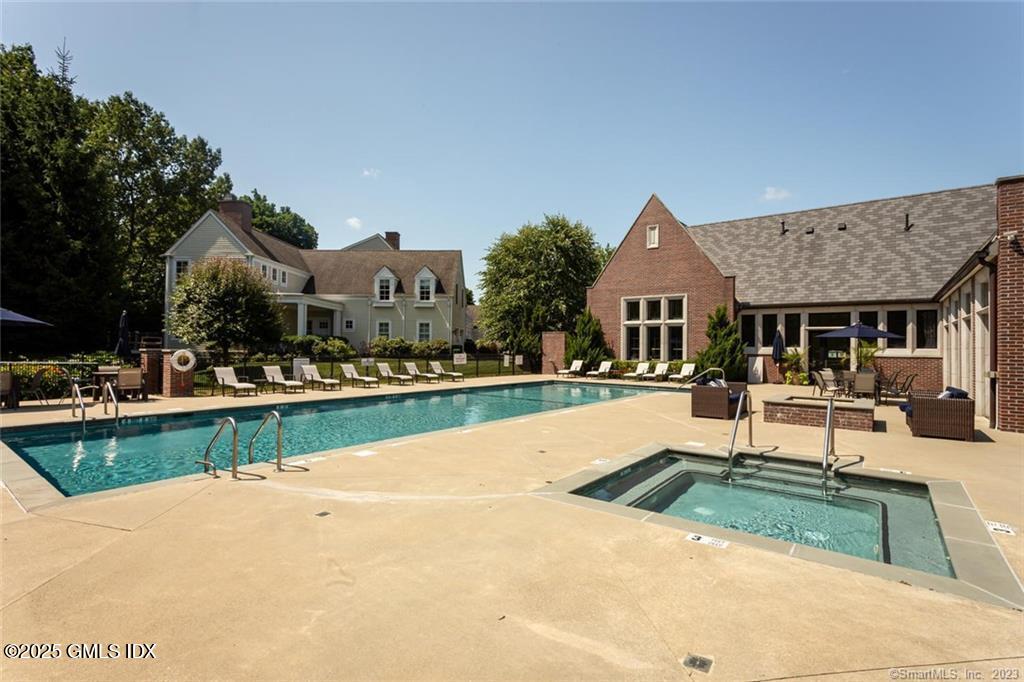 77 Havemeyer Lane, Unit 426 Stamford, CT 06902 - Photo 22 of 23 a view of house with swimming pool and outdoor seating