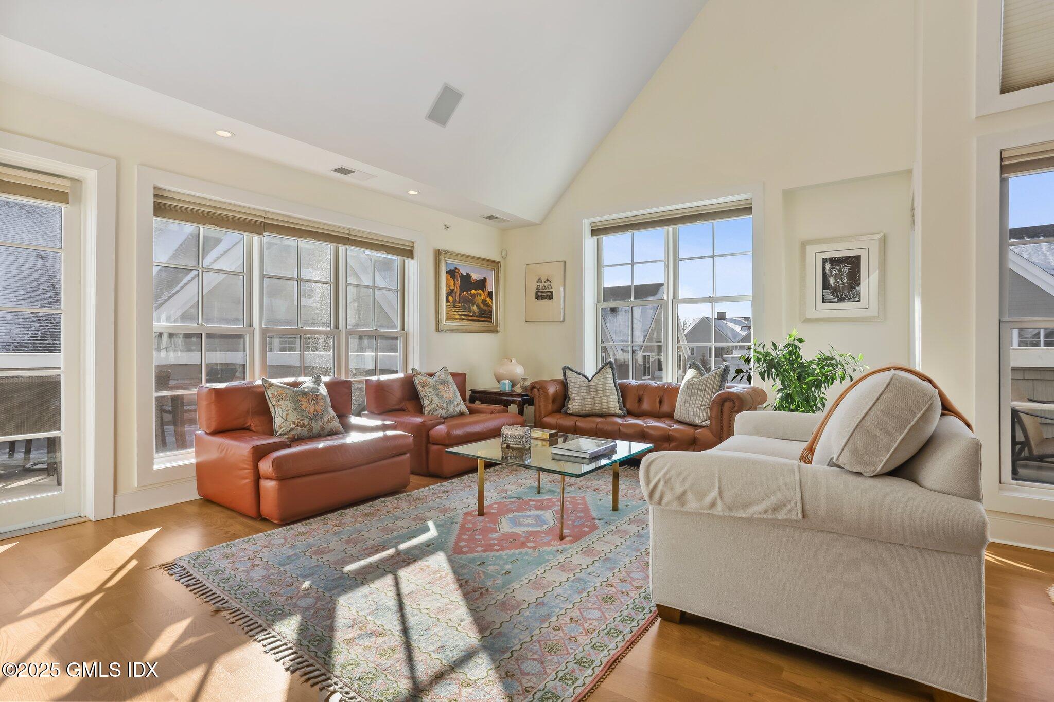 77 Havemeyer Lane, Unit 426 Stamford, CT 06902 - Photo 3 of 23 a living room with furniture and a large window