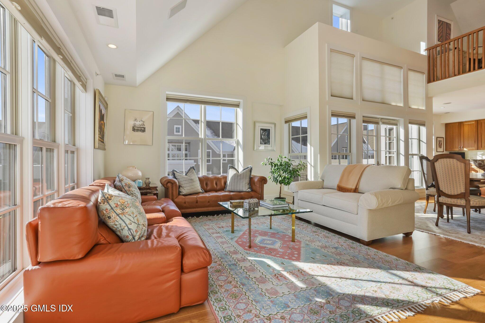 77 Havemeyer Lane, Unit 426 Stamford, CT 06902 - Photo 4 of 23 a living room with furniture and a large window
