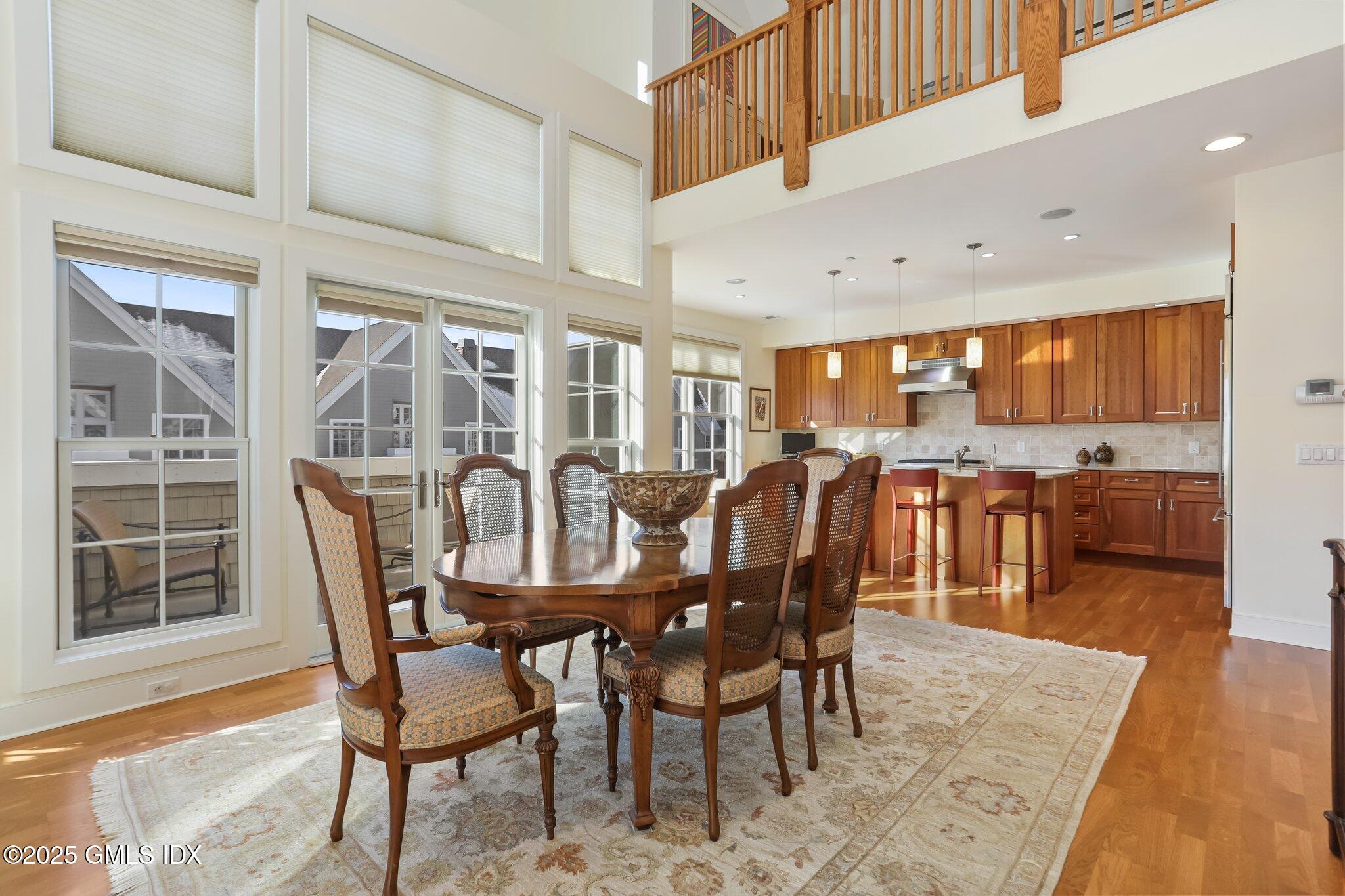 77 Havemeyer Lane, Unit 426 Stamford, CT 06902 - Photo 9 of 23 a view of a dining room with furniture