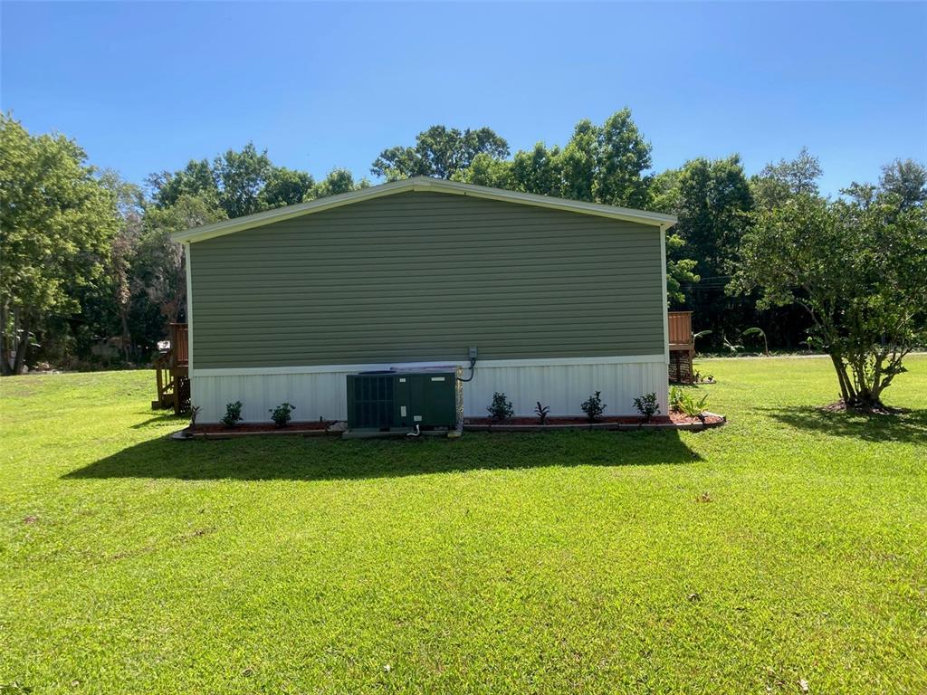 18137 Hollister Road Orlando, FL 32820 - Photo 27 of 27 a backyard of a house with table and chairs