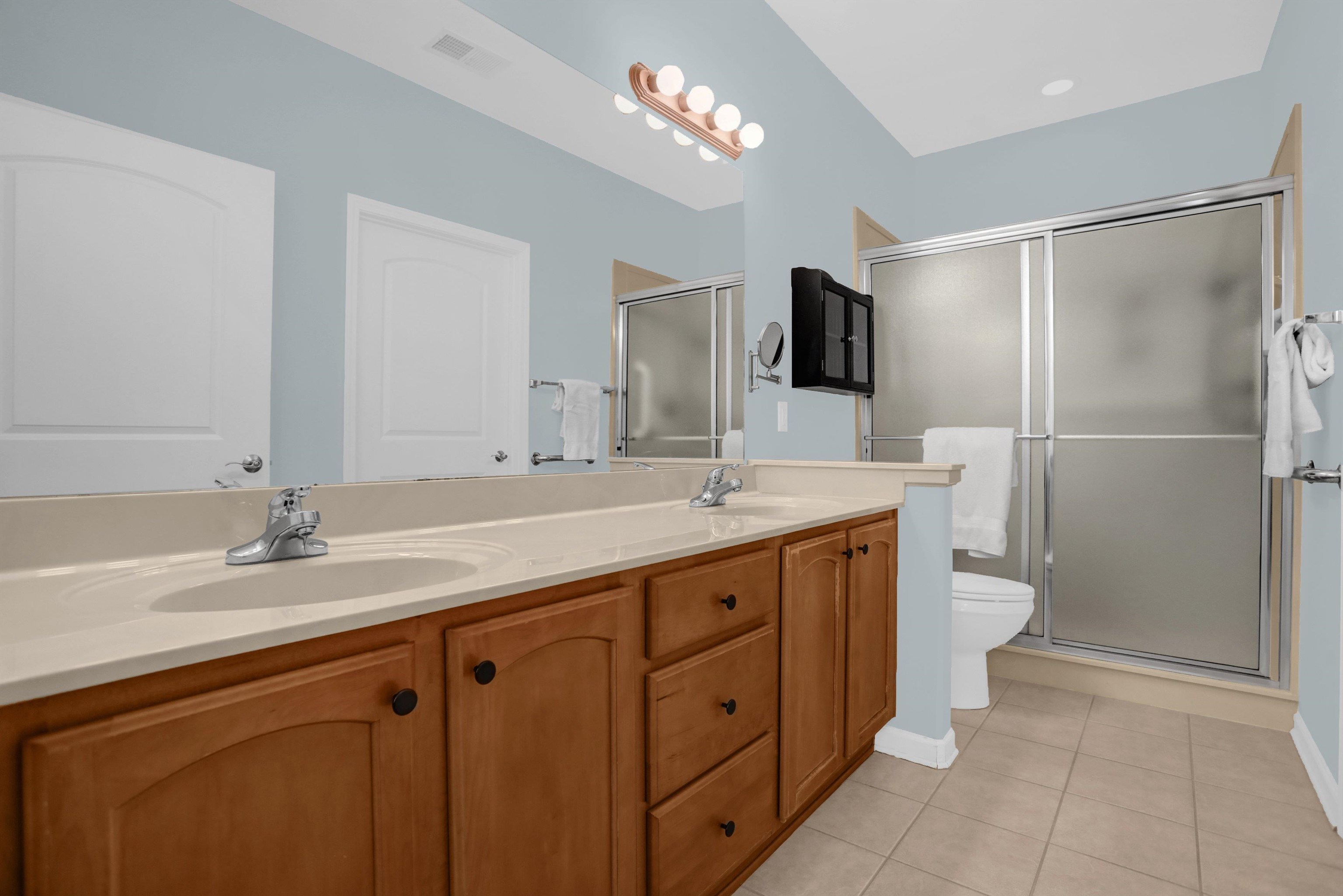 34 Peyton Ridge Drive, Unit 21 Collierville, TN 38017 - Photo 27 of 37 Bathroom featuring a double vanity with wood cabinetry and light-toned countertops