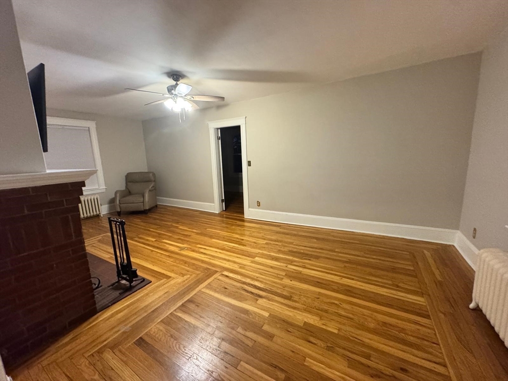 14 East Prospect Street Methuen, MA 01844 - Photo 4 of 9 a view of empty room with wooden floor and fan