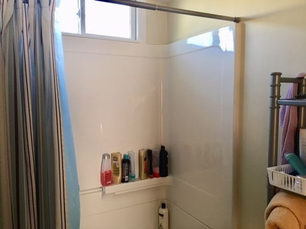 126 Allen Street Springfield, MA 01108 - Photo 6 of 10 a bathroom with a bathtub and a window