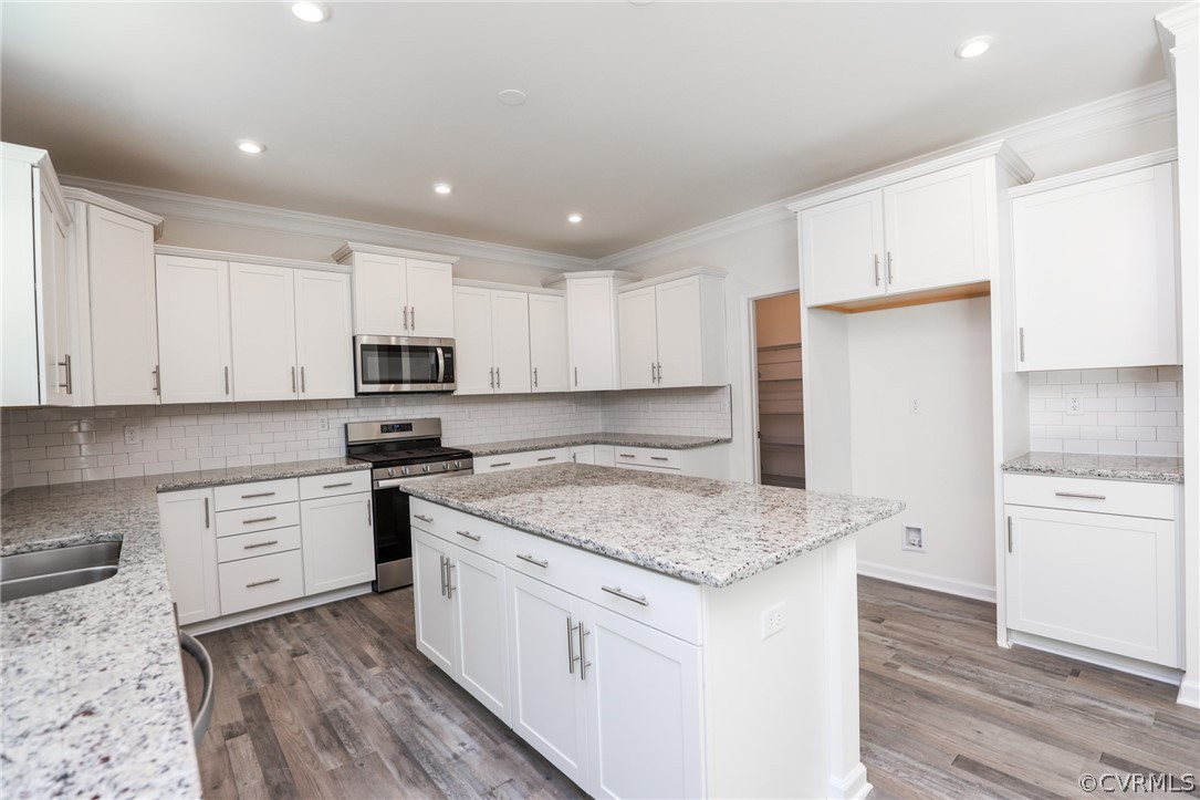 4113 Tosh Lane Chester, VA 23831 - Photo 12 of 47 a kitchen with granite countertop white cabinets and white appliances