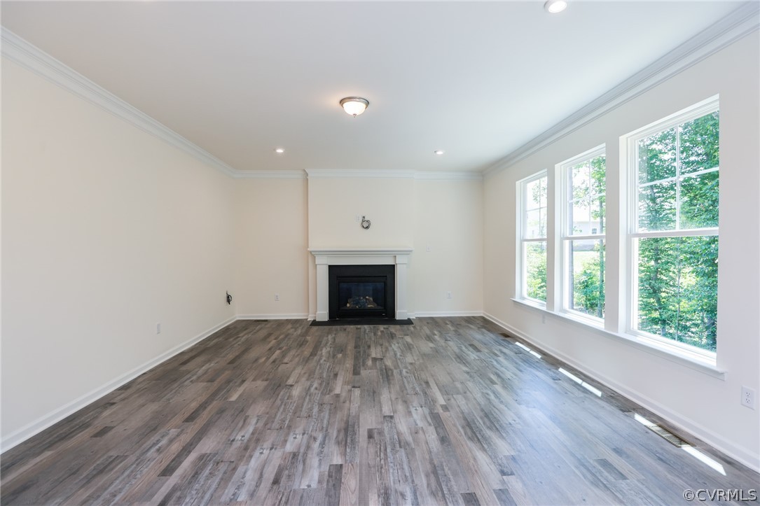 4113 Tosh Lane Chester, VA 23831 - Photo 15 of 47 a view of empty room with wooden floor and fireplace
