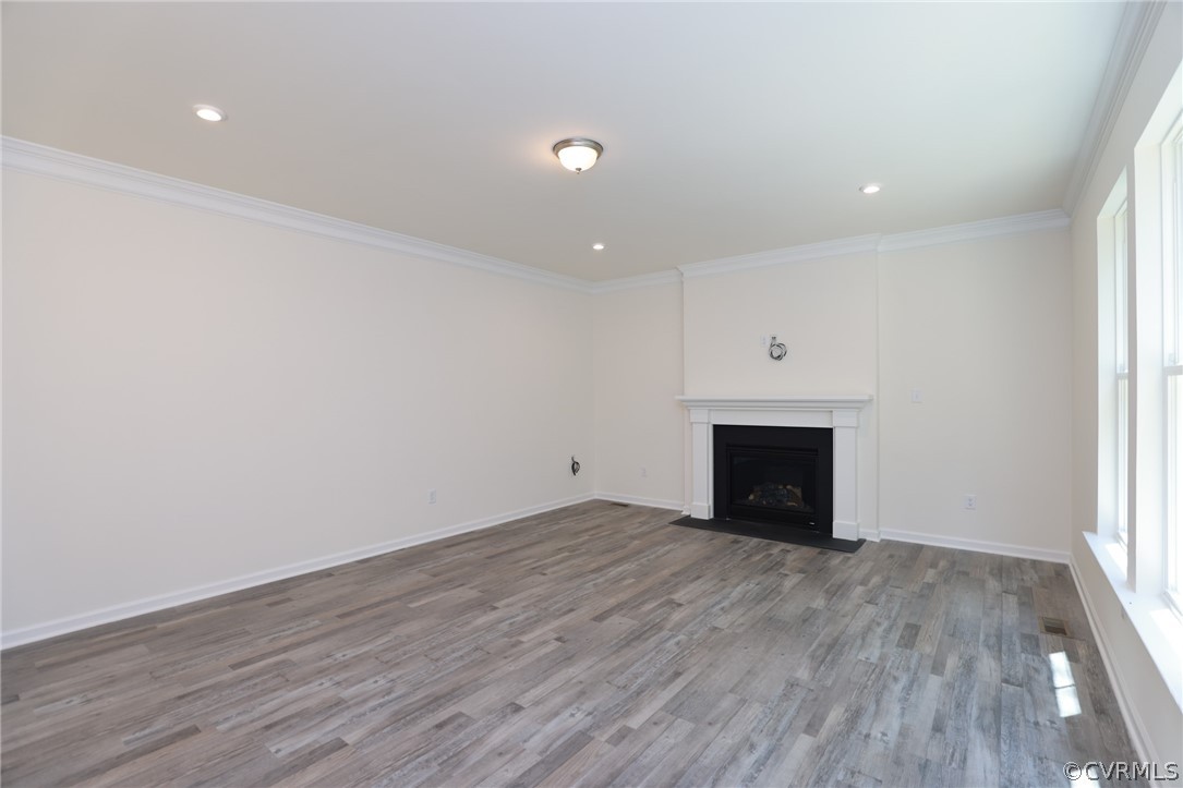 4113 Tosh Lane Chester, VA 23831 - Photo 17 of 47 a view of an empty room with wooden floor and a window