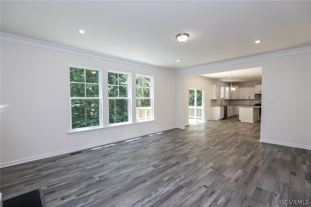 4113 Tosh Lane Chester, VA 23831 - Photo 18 of 47 a view of empty room with wooden floor and windows