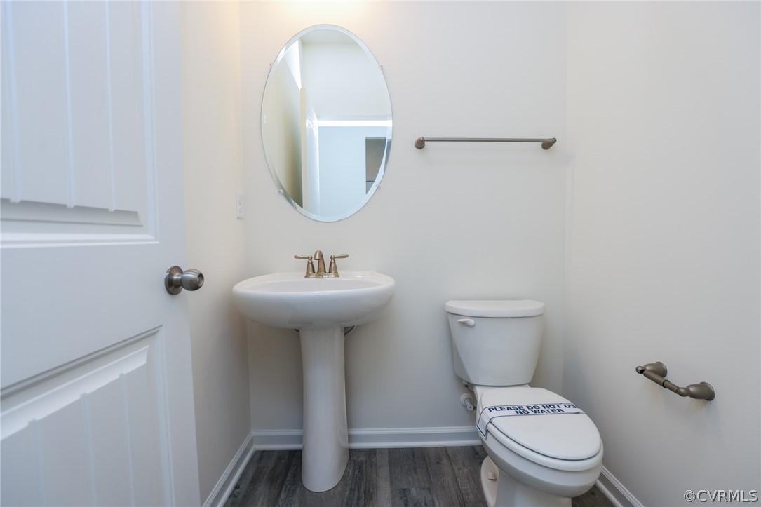 4113 Tosh Lane Chester, VA 23831 - Photo 20 of 47 a bathroom with a toilet sink and mirror