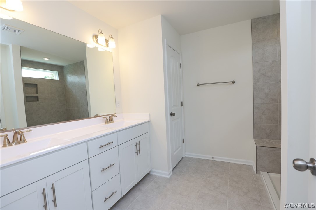 4113 Tosh Lane Chester, VA 23831 - Photo 26 of 47 a bathroom with a double vanity sink and mirror