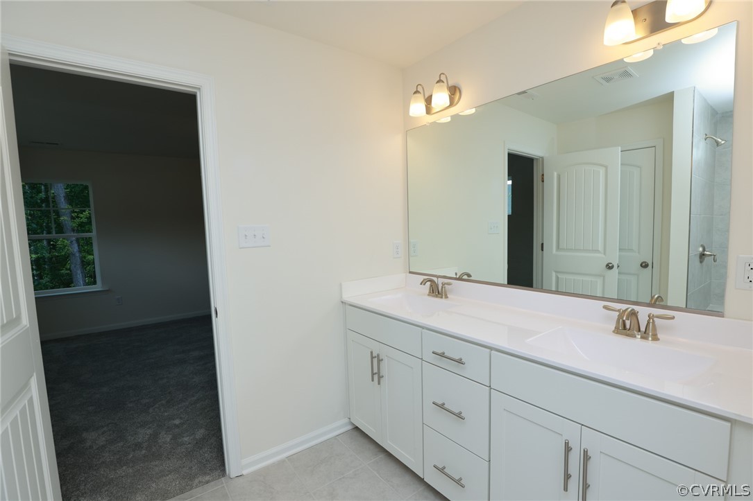 4113 Tosh Lane Chester, VA 23831 - Photo 28 of 47 a bathroom with a double vanity sink and a mirror