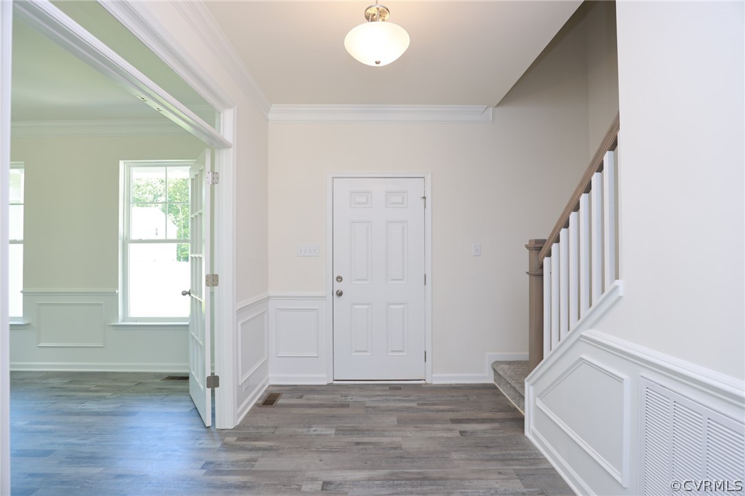 4113 Tosh Lane Chester, VA 23831 - Photo 6 of 47 a view of an empty room with wooden floor and a window