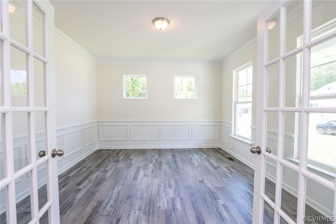 4113 Tosh Lane Chester, VA 23831 - Photo 7 of 47 an empty room with wooden floor and windows