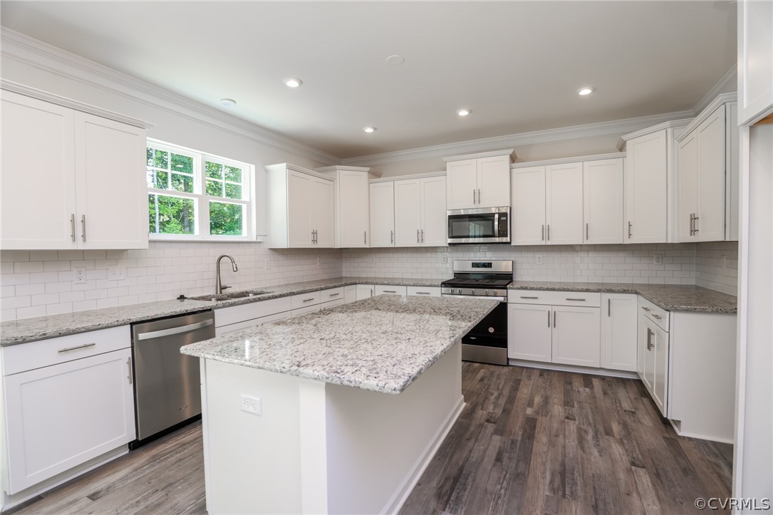 4113 Tosh Lane Chester, VA 23831 - Photo 10 of 47 a kitchen with a sink window and cabinets