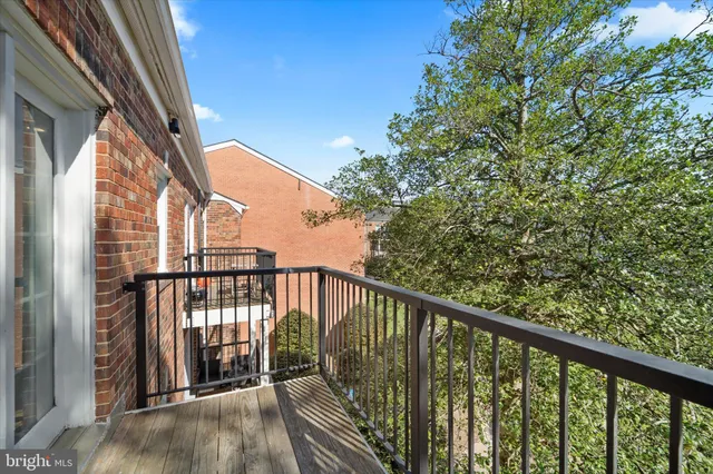 a view of balcony with wooden floor