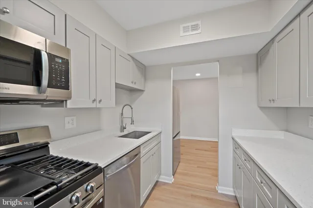 a kitchen with a stove and a microwave