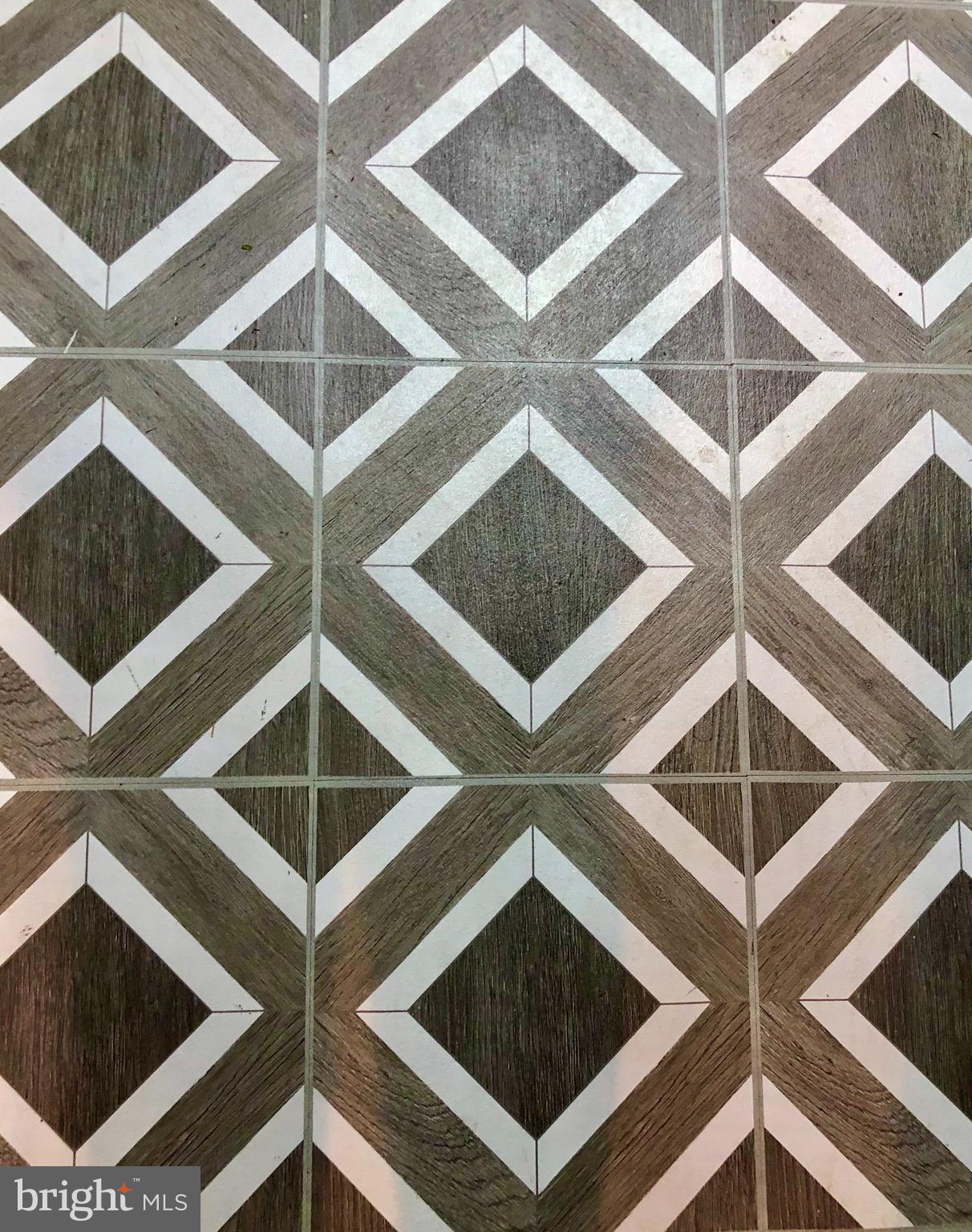 4302 Cortez Road Baltimore, MD 21225 - Photo 25 of 29 New tile floor in the utility room