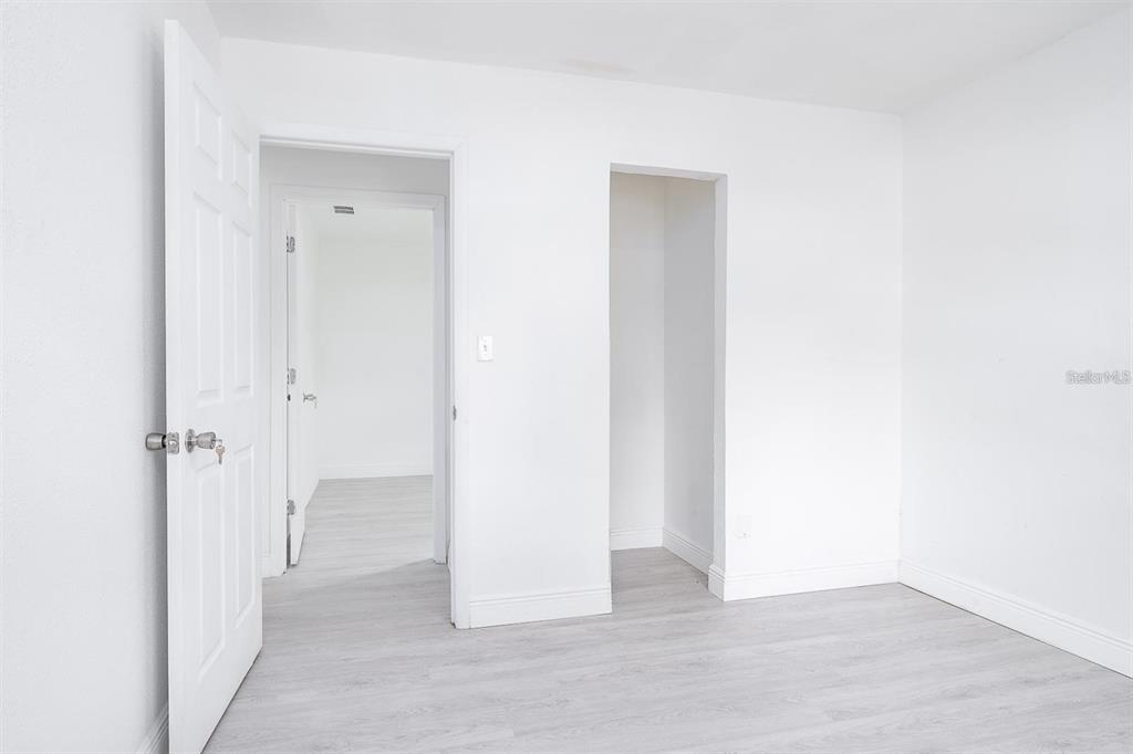 519 Williams Street Melbourne, FL 32901 - Photo 13 of 15 a view of a hallway with wooden floor