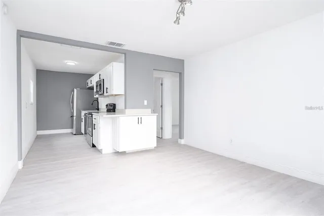 a view of a kitchen with a sink