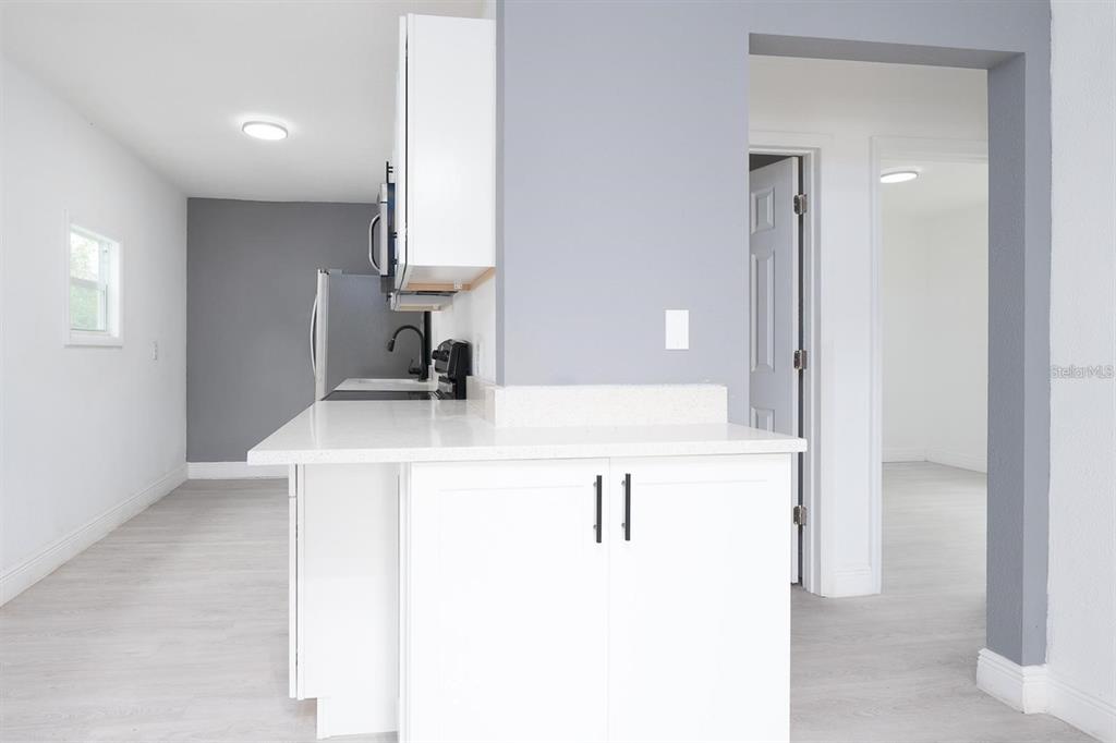 519 Williams Street Melbourne, FL 32901 - Photo 5 of 15 a bathroom with a sink vanity and a mirror