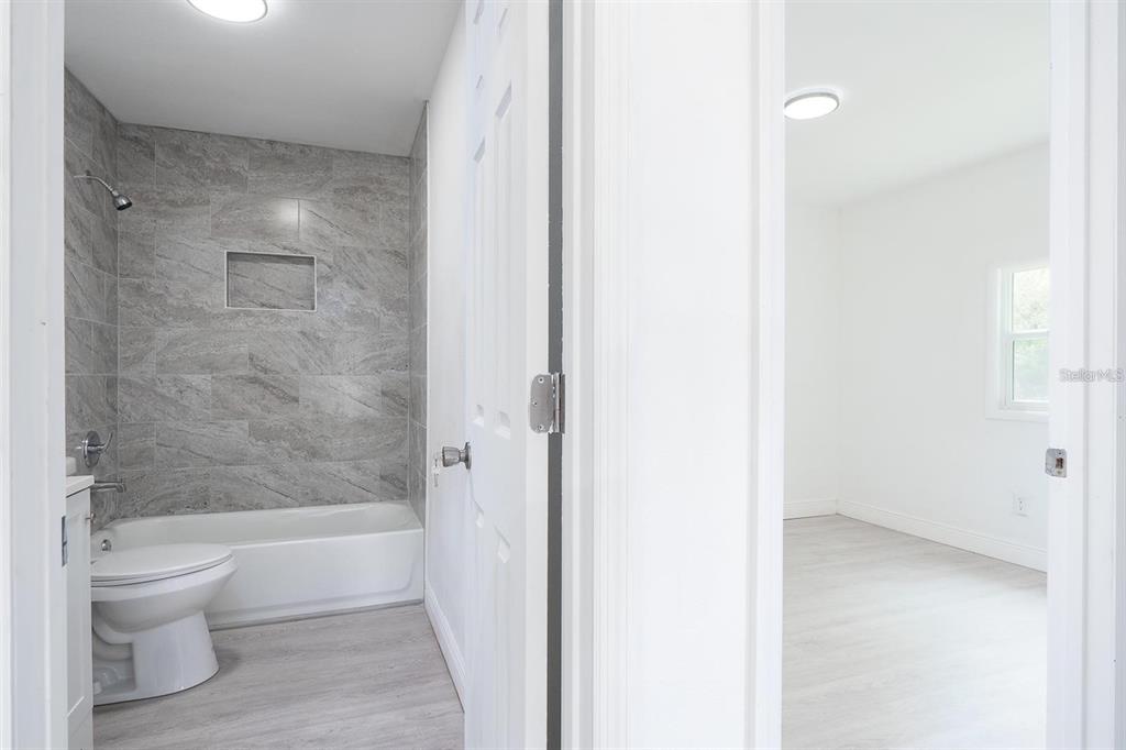 519 Williams Street Melbourne, FL 32901 - Photo 10 of 15 a bathroom with a bathtub and a toilet