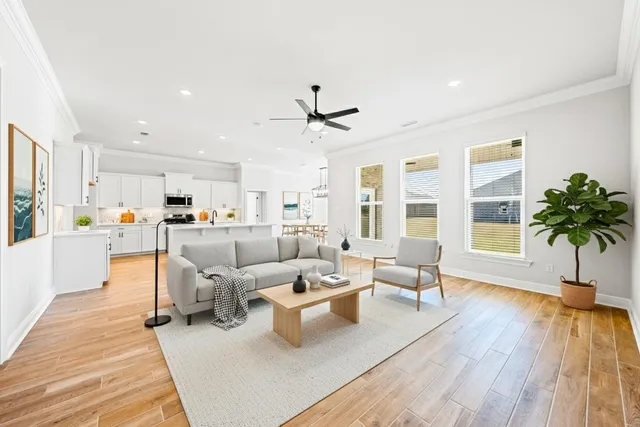 a living room with furniture and a large window with outer view