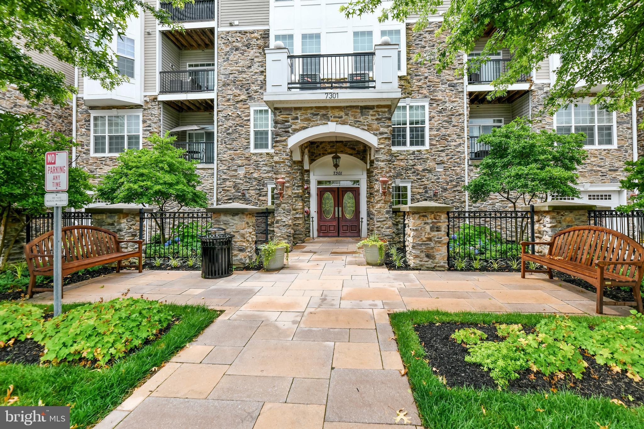 7301 Travertine Drive, Unit 403 Baltimore, MD 21209 - Photo 2 of 27 STATELY COURTYARD ENTRANCE